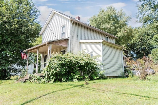 view of property exterior featuring a lawn