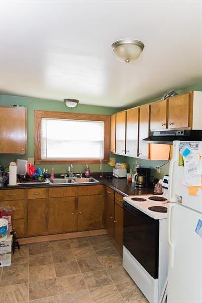 kitchen featuring white appliances, sink, and light tile floors