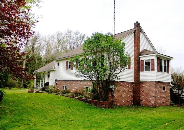 view of home's exterior featuring a lawn