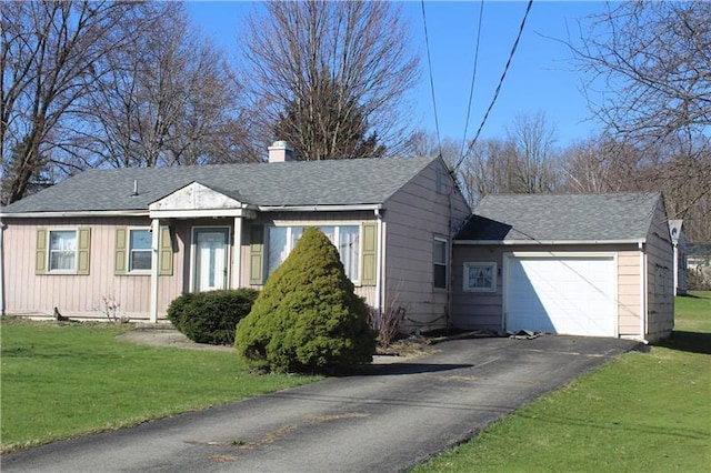 view of front facade featuring a front lawn and a garage