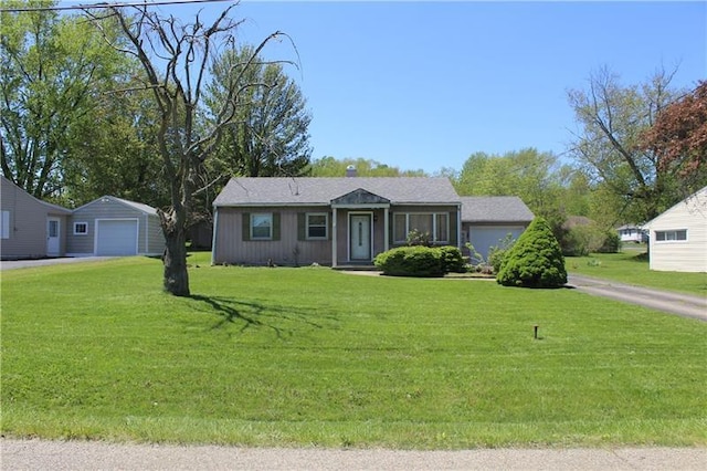 single story home featuring a front yard and a garage