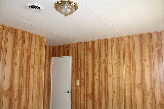 room details featuring wood walls