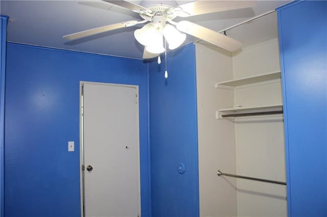 interior space with ceiling fan