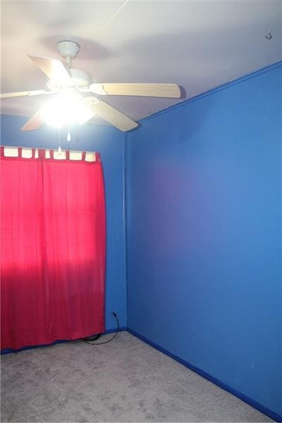 carpeted empty room with ceiling fan