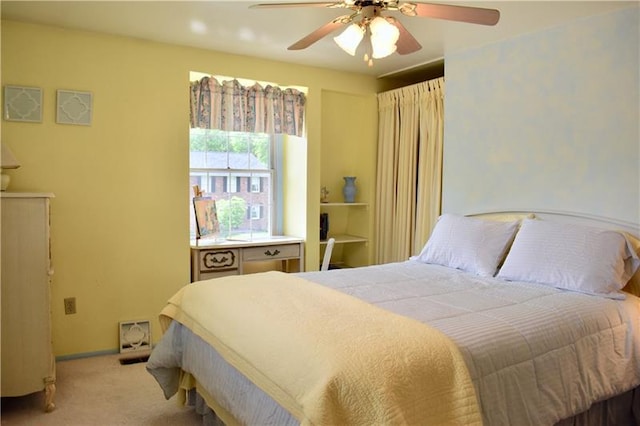 bedroom featuring light colored carpet and ceiling fan