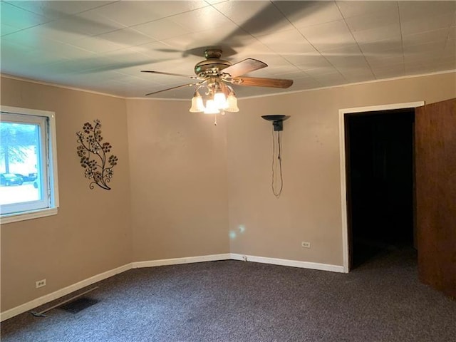 carpeted empty room with ceiling fan