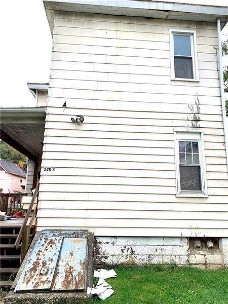 view of side of home with a wooden deck