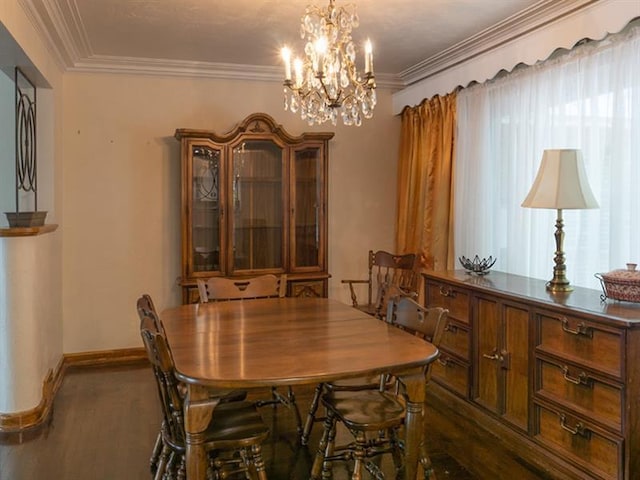 dining space featuring an inviting chandelier and crown molding