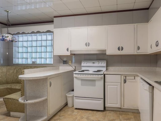 kitchen with white cabinetry, decorative light fixtures, light tile flooring, white appliances, and crown molding