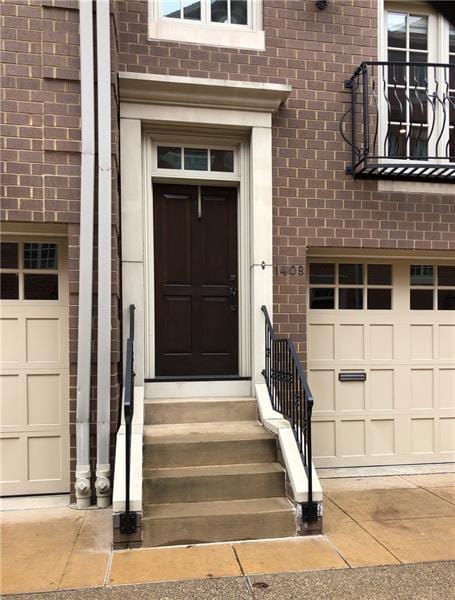 view of exterior entry with a garage