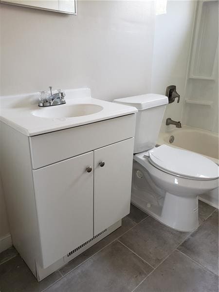 full bathroom featuring tile flooring, toilet, vanity, and shower / bath combination