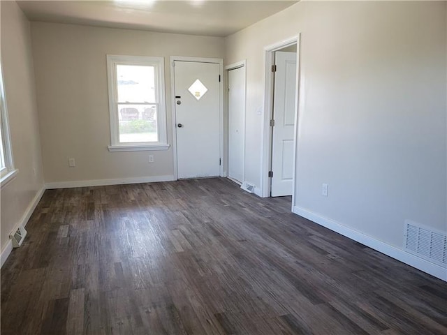 entrance foyer featuring dark hardwood / wood-style flooring