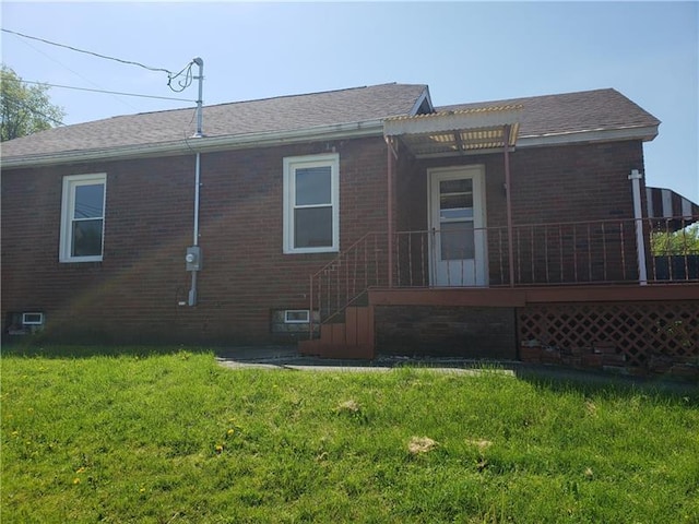 exterior space with a lawn and a deck