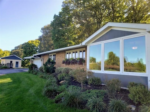 view of home's exterior featuring a yard