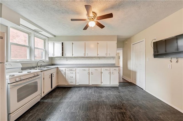 kitchen featuring backsplash, ceiling fan, white appliances, sink, and white cabinets