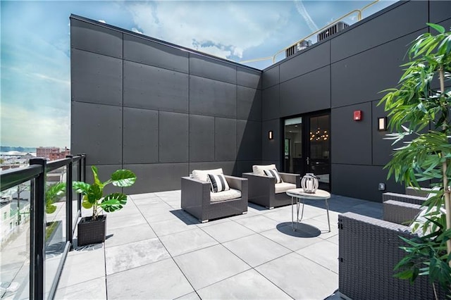 view of terrace with a balcony and an outdoor hangout area