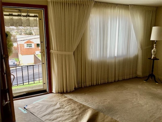 interior space featuring light colored carpet