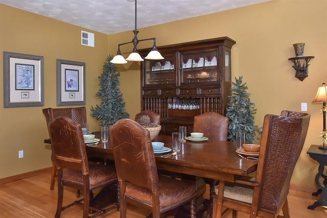 dining room featuring light hardwood / wood-style floors