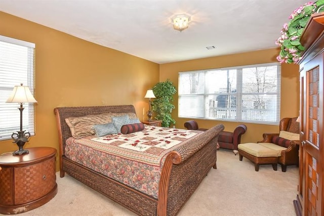 bedroom with light colored carpet