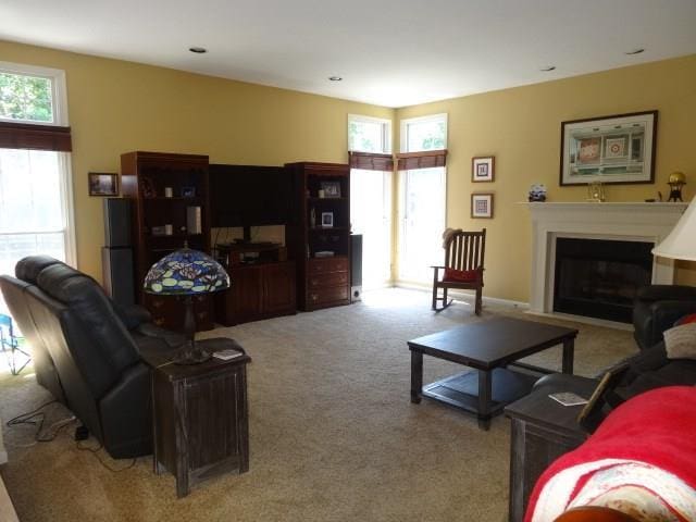 living room with light carpet and a wealth of natural light