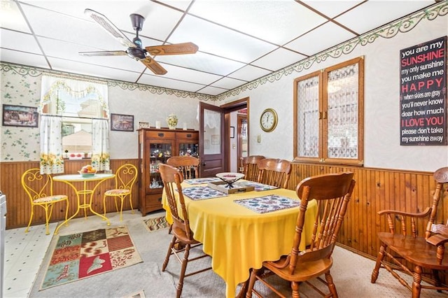 dining room with a drop ceiling and ceiling fan