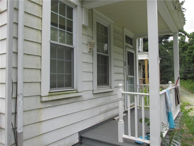 view of side of home featuring a porch