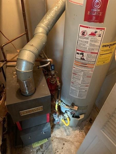 utility room featuring gas water heater