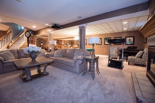 interior space with decorative columns and light colored carpet