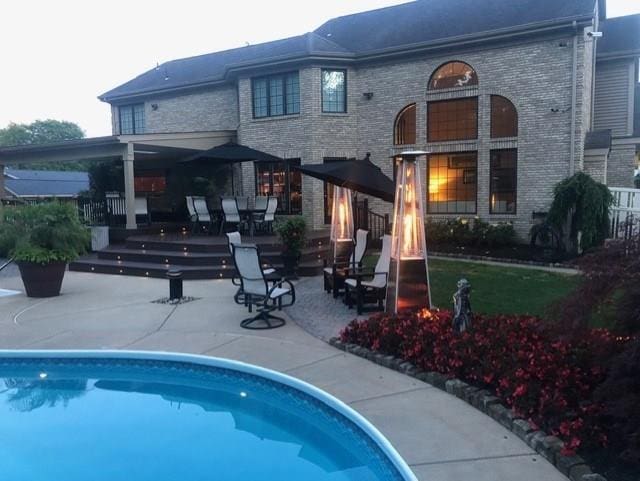 rear view of house with a patio