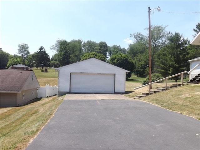 garage featuring a yard