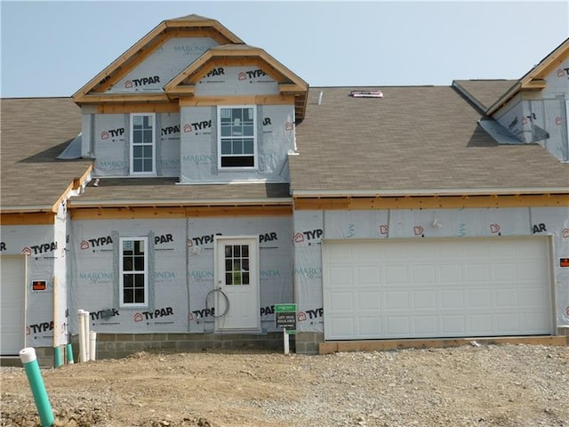 unfinished property with a garage