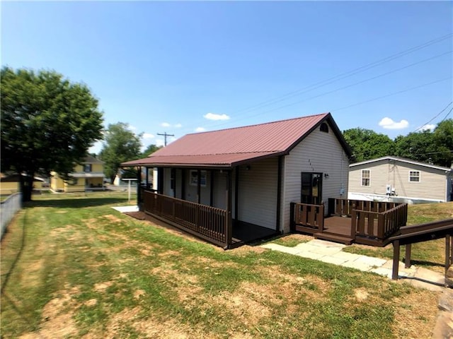 exterior space with a lawn and a deck