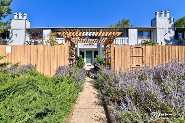 view of home's exterior with a pergola