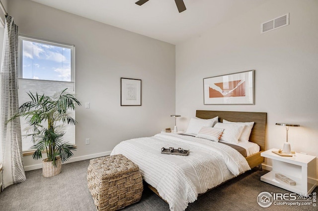 bedroom with ceiling fan and carpet flooring