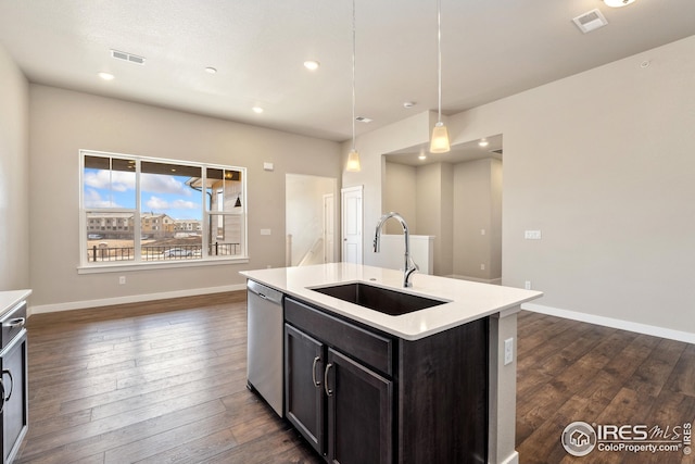 938 Schlagel St Unit 7, Fort Collins, CO 80524 - kitchen featuring light countertops, visible vents, dark wood finished floors, a sink, and stainless steel dishwasher