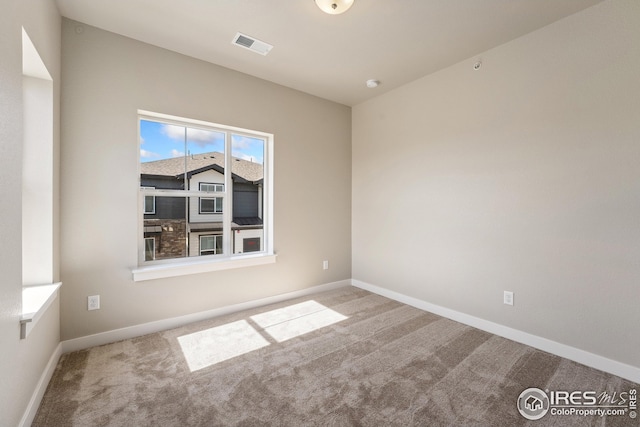 938 Schlagel St Unit 7, Fort Collins, CO 80524 - carpeted spare room with baseboards and visible vents