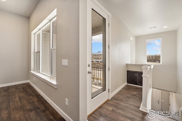 938 Schlagel St Unit 7, Fort Collins, CO 80524 - hallway with dark wood finished floors, baseboards, and visible vents