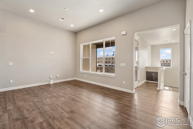 938 Schlagel St Unit 7, Fort Collins, CO 80524 - empty room featuring baseboards, visible vents, wood finished floors, and recessed lighting