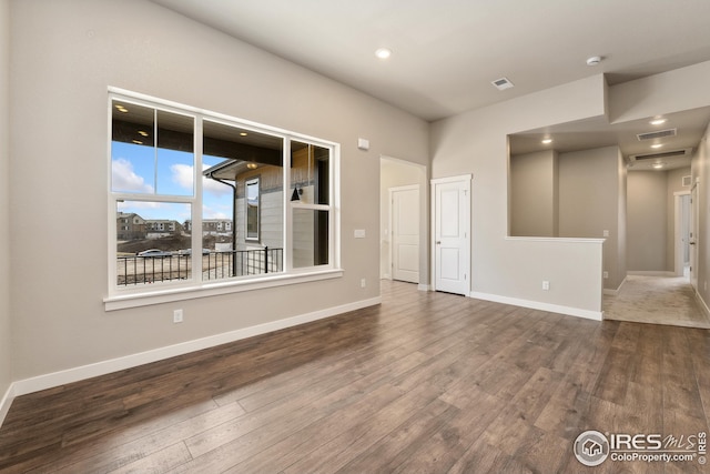 938 Schlagel St Unit 7, Fort Collins, CO 80524 - spare room with baseboards, visible vents, and wood finished floors