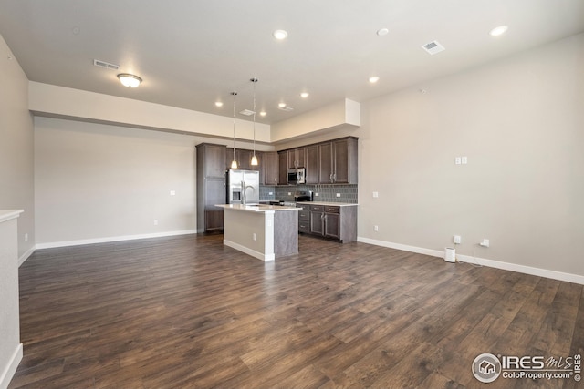 938 Schlagel St Unit 7, Fort Collins, CO 80524 - kitchen with light countertops, visible vents, dark brown cabinets, appliances with stainless steel finishes, and open floor plan