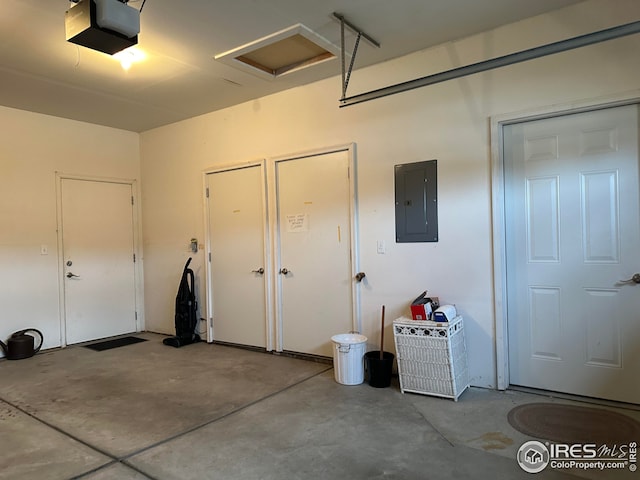 garage with electric panel and a garage door opener