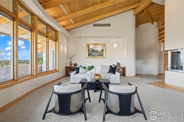 living room with high vaulted ceiling, wooden ceiling, and beam ceiling