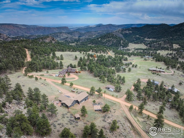 birds eye view of property featuring a rural view and a mountain view