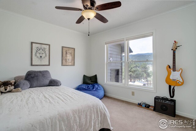 bedroom featuring baseboards, carpet floors, and crown molding