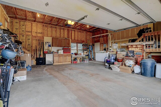 garage featuring a workshop area and a garage door opener