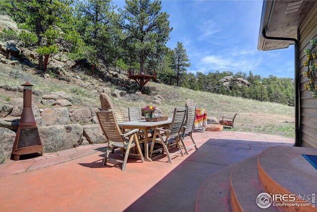 view of patio featuring outdoor dining space