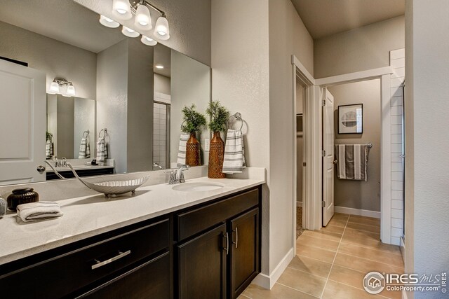 bathroom with vanity and tile patterned floors