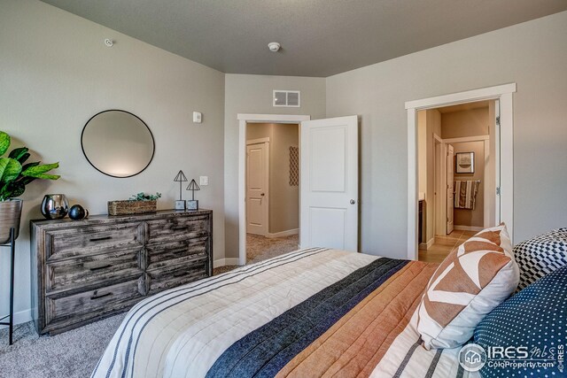 bedroom with light carpet