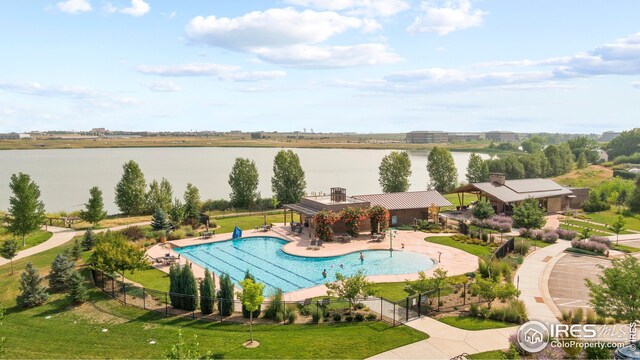 view of swimming pool featuring a gazebo, a lawn, a water view, and a patio area