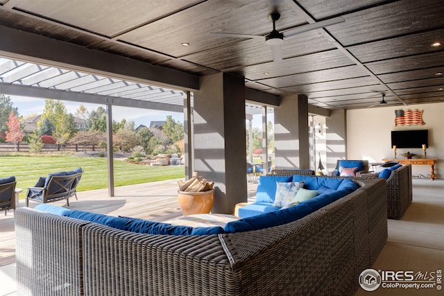 view of patio / terrace with ceiling fan, an outdoor hangout area, and a pergola